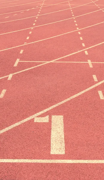 Número 1 en pista de atletismo fondo vintage — Foto de Stock