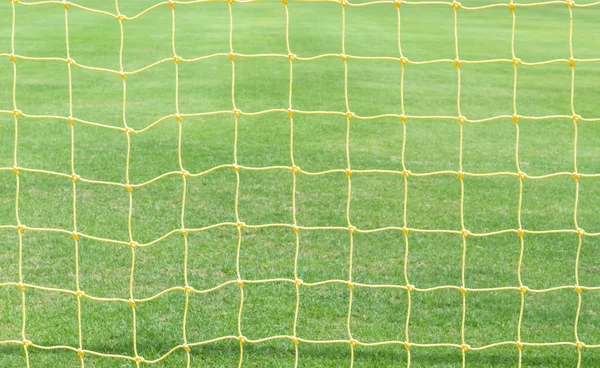 Goal net with green football field vintage — Stock Photo, Image