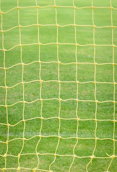 Red de goles con campo de fútbol verde vintage — Foto de Stock