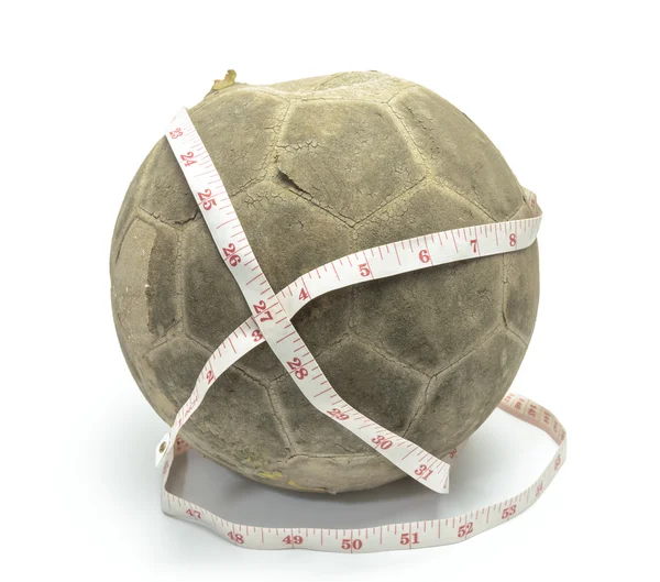 Old football with measuring tape — Stock Photo, Image