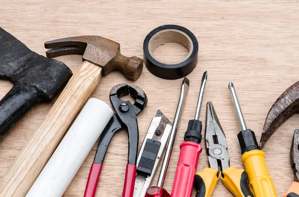 Set of different tools for work on wood background — Stock Photo, Image