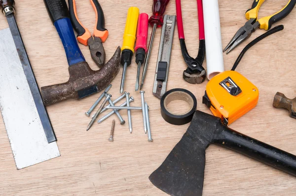 Set of different tools for work on wood background — Stock Photo, Image