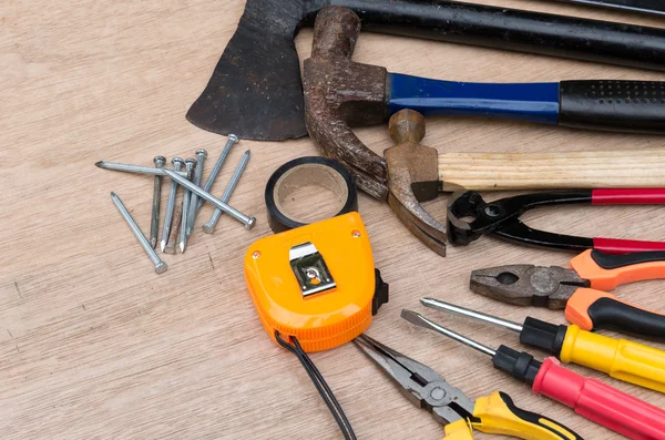 Set of different tools for work on wood background — Stock Photo, Image