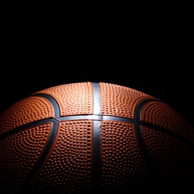Basketball on black background. clipart