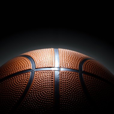 Basketball on black background clipart
