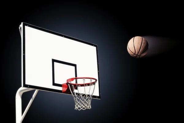 Basketball heading the hoop with spotlights — Stock Photo, Image