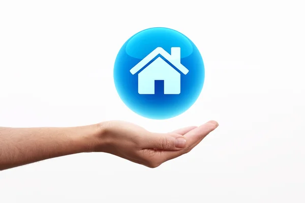 Home icon on hand — Stock Photo, Image