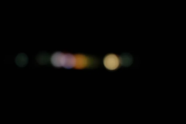 城市防波堤中的抽象灯光和分散的灯光 夜色模糊的背景 — 图库照片