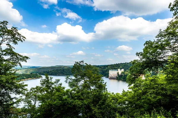 Orlik castle with blue sky and trees-Orlik nad Vltavou South Bohemia, Czech Republic