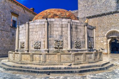 Medieval Onofrio public fountain located in old town of Dubrovnik, Croatia. clipart