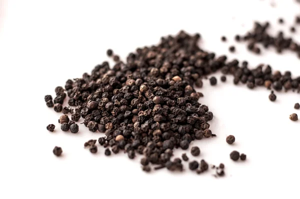 Black pepper was placed on a white background — Stock Photo, Image