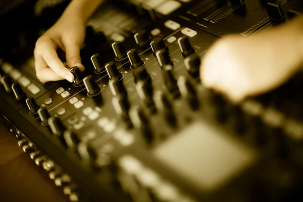 DJ mixing music on console at the club — Stock Photo, Image