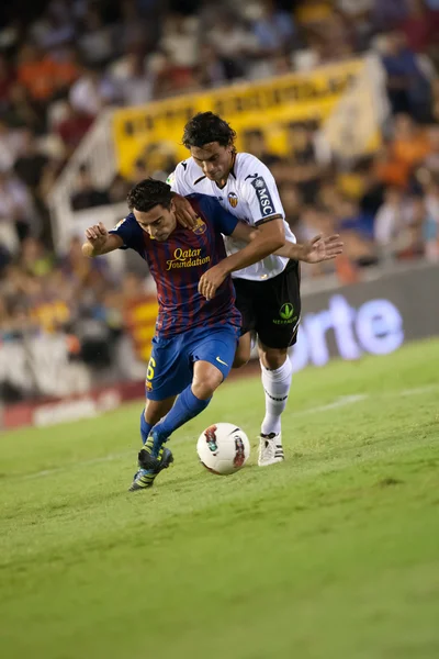 Xavi hernandez und tino costa im einsatz — Stockfoto