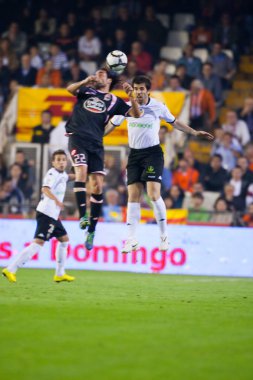 David Albelda (L) and Juan Rodriguez (R) and Jordi Alba in action