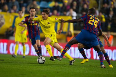 David Fuster (C), Yaya Toure (R) ve Xavi (L) eylem