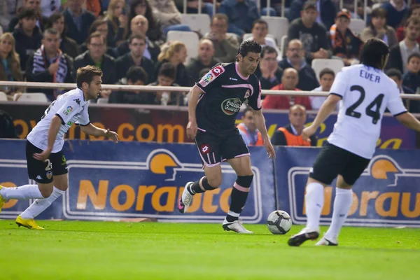 Riki (C), någonsin Maximiliano Banega (R) och Jordi Alba (L) i aktion — Stockfoto