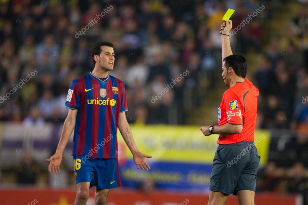 Sergio Busquets receive a yellow card Stock Editorial Photo © lakasa