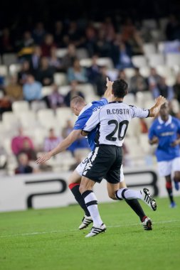 Ricardo Costa (R) ve Kenny Miller (L) oyun sırasında