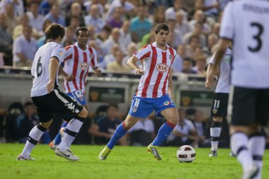 Fran Merida (C) ve David Albelda (L) oyun sırasında