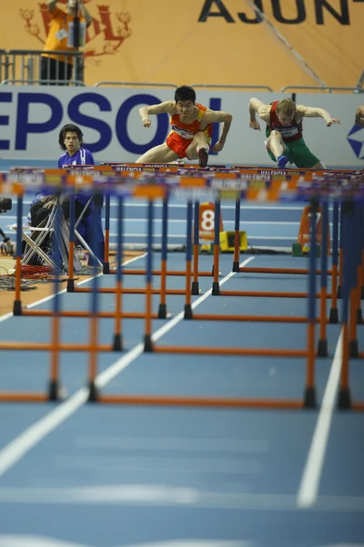 Dongpeng Shi of China compete in the Mens 60 Metres Hurdles Heat — Stock Photo, Image