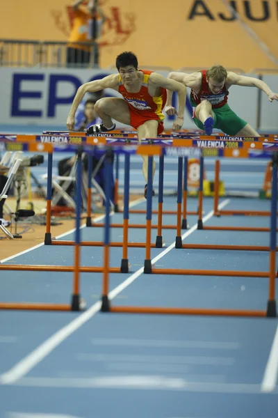 Dongpeng Shi of China compete in the Mens 60 Metres Hurdles Heat — Stock Photo, Image