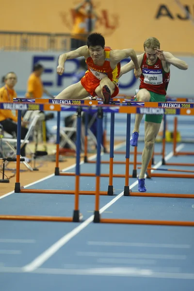 Dongpeng Shi of China compete in the Mens 60 Metres Hurdles Heat — Stock Photo, Image