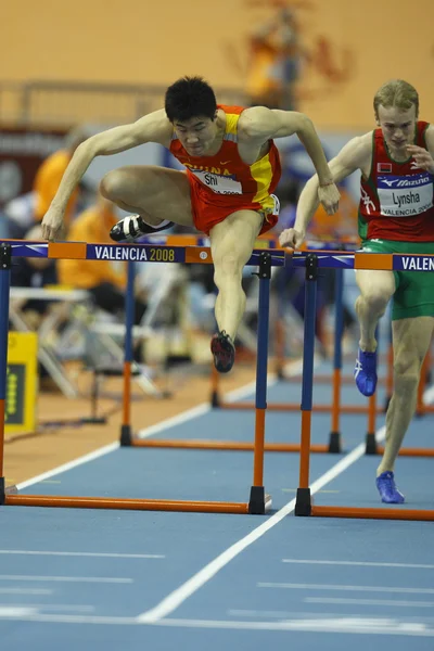 Dongpeng Shi van China concurreren in de Mens 60 meter horden hitte — Stockfoto