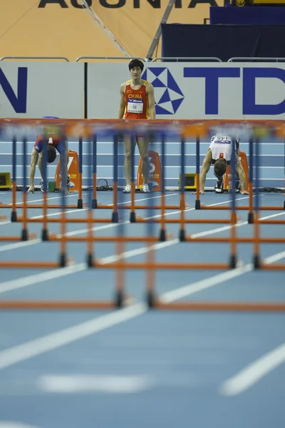 Лю Сян из Китая участвует в финале Mens 60 Metres Hurdles Heat — стоковое фото