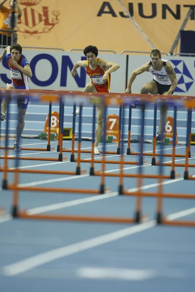 Лю Сян из Китая участвует в финале Mens 60 Metres Hurdles Heat — стоковое фото