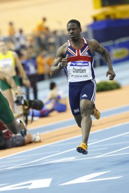 Dwain Chambers competes at the men 60 metres clipart