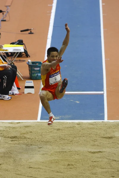 Li from China competes in the Mens Long Jump — Stock Photo, Image