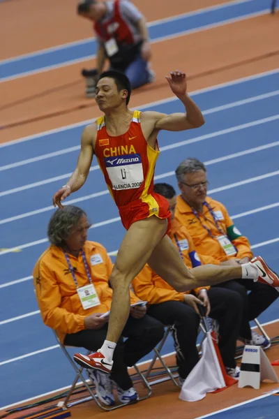 Li de China compite en el salto largo para hombre — Foto de Stock