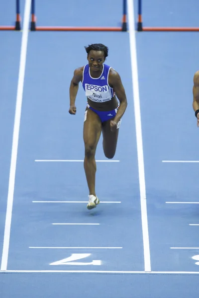 Rejalá-Flor Okori compite en los 60 metros de obstáculos femeninos —  Fotos de Stock