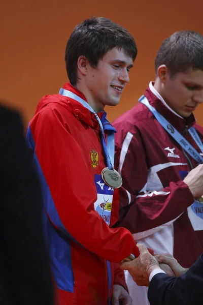 Evgeniy Borisov e Sta=islavs Olijars com medalhas de bronze nos obstáculos masculinos de 60 metros — Fotografia de Stock