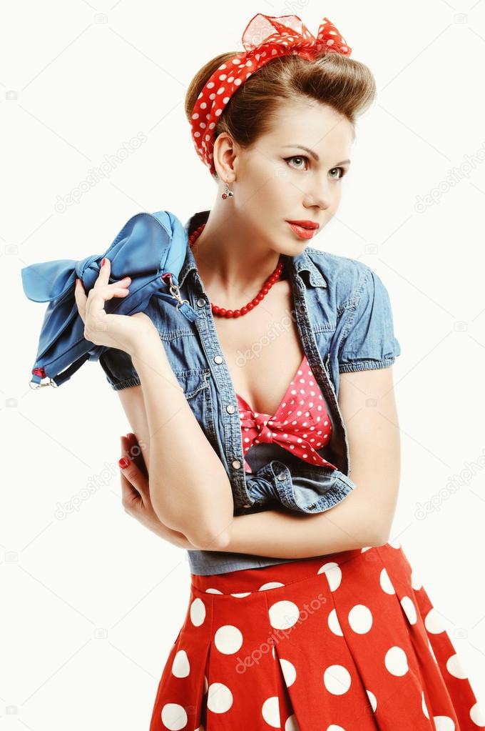 Pin-up young woman in vintage American style with a clutch