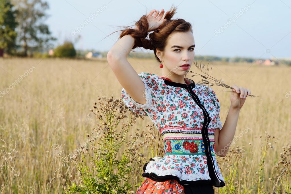 https://st2.depositphotos.com/3727075/5685/i/950/depositphotos_56859833-stock-photo-young-peasant-woman-dressed-in.jpg
