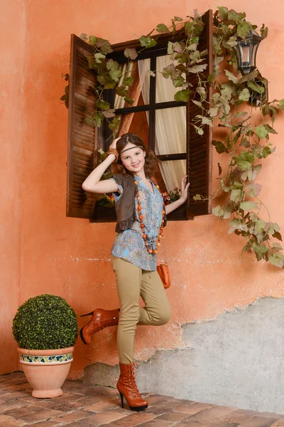 Young girl near the window — Stock Photo, Image