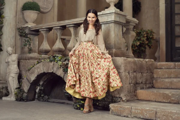 Young beautiful woman in flower skirt — Zdjęcie stockowe