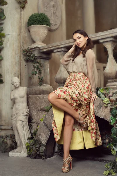 Young beautiful woman in flower skirt — Stock Photo, Image