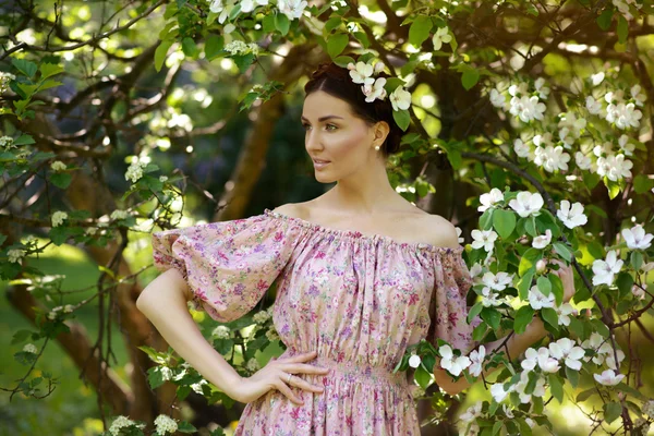 Young beautiful woman in the garden — Stock Photo, Image