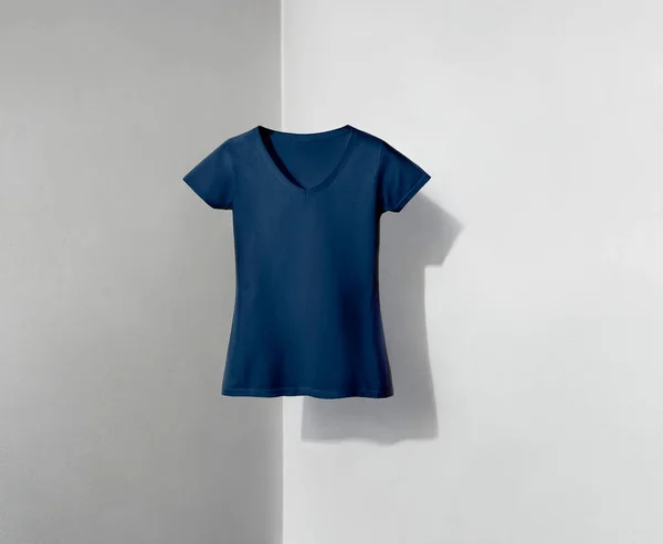 blue navy v-neck shaped t-shirt for women on white and grey background with shadow