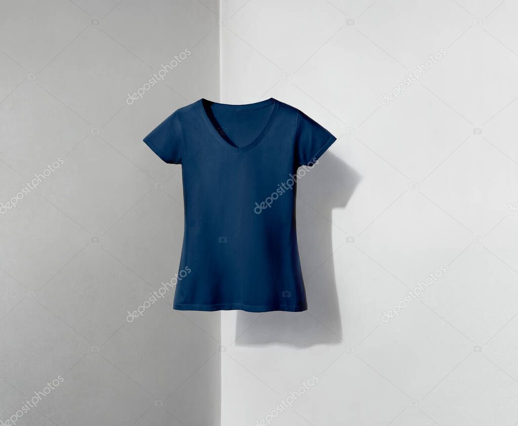 Blue navy v-neck shaped t-shirt for women on white and grey background with shadow