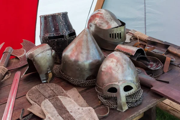 Old Shabby Helmets Medieval Weapons Wooden Table — Stock Photo, Image