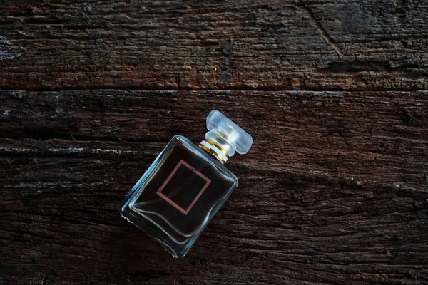 Perfume Bottle Sits Beautifully Wooden Floor — Stock Photo, Image