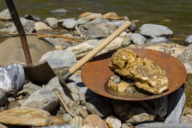 Gold Nugget mining from the River clipart