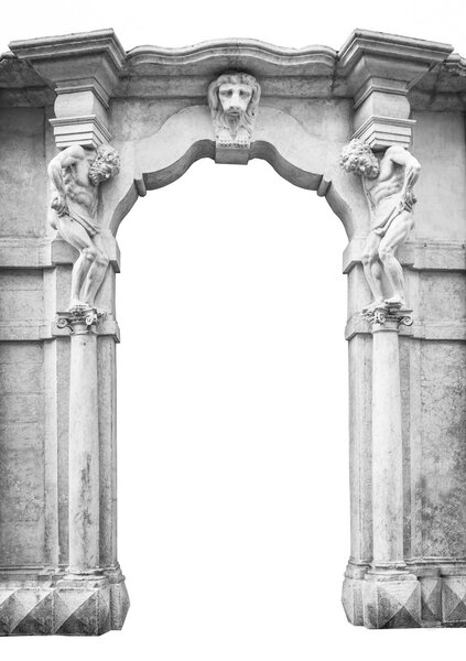 Old white stone entrance with statues that support the columns.