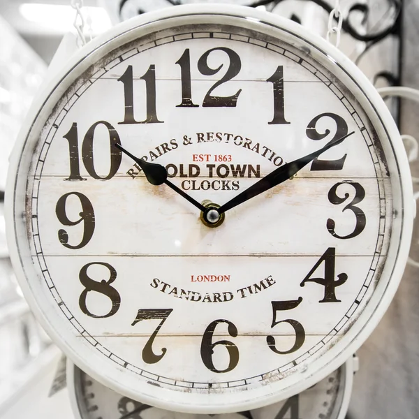 Neutral colored clock in classic style. — Stock Photo, Image