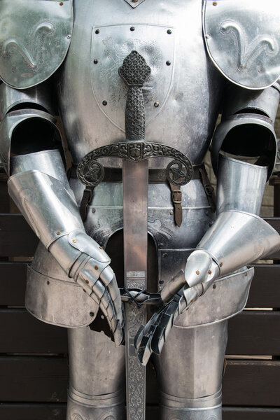 Detail of an old shiny medieval armor.