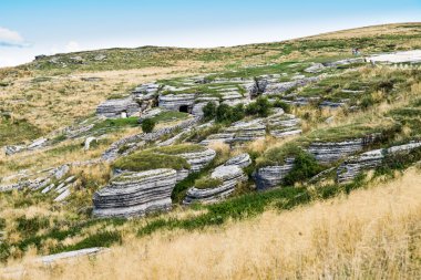 Trench dug in the rock dating back to World War I clipart