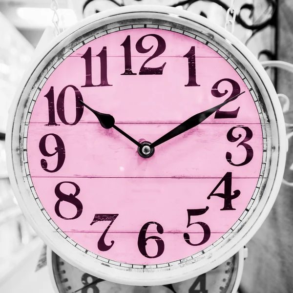 Pink clock in a classical style. — Stock Photo, Image